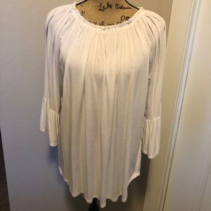 3/4 sleeve white, flowy top. Beautiful quality